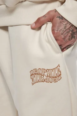 HEAVY MIRRORED LOGO JOGGER COCONUT MILK